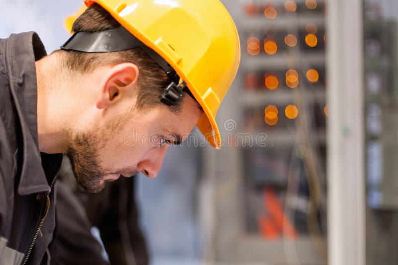 Engineer commissioning bay control unit. Engineering department royalty free stock image Engineer commissioning bay control unit. Engineering department royalty free stock image
