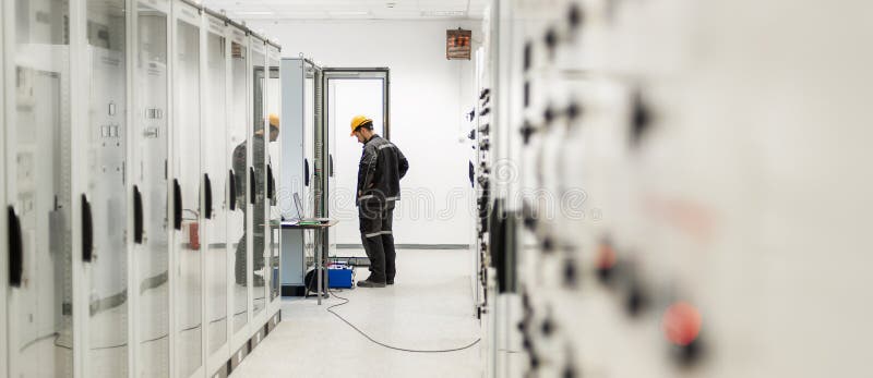 Engineer commissioning bay control unit. Engineering department royalty free stock photo