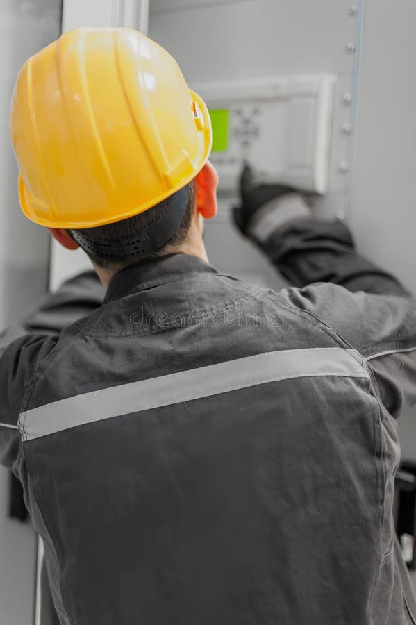 Engineer commissioning bay control unit. Engineering department royalty free stock photography