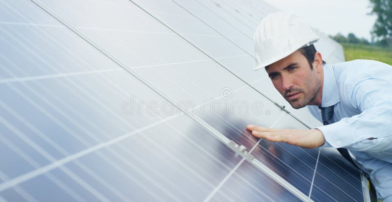 Engineer expert in solar energy photovoltaic panels with remote control performs routine actions for system monitoring using clean, renewable energy. concept applied to the remote support technology.