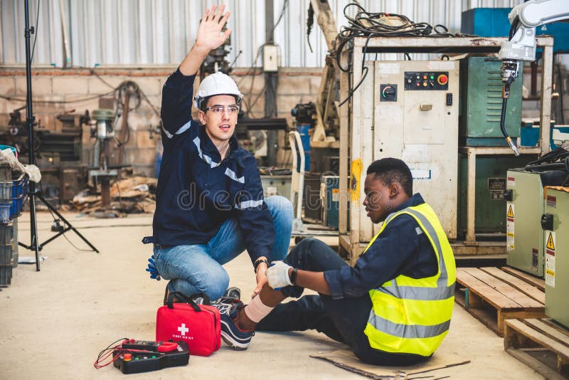 Engineer or foreman has an accident while working on steel factory workshop. Industry robot programming software for automated stock photo