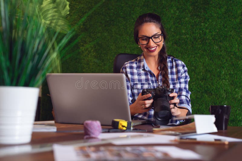 Engineer Looking at Photos that she Took on Camera that Morning Stock