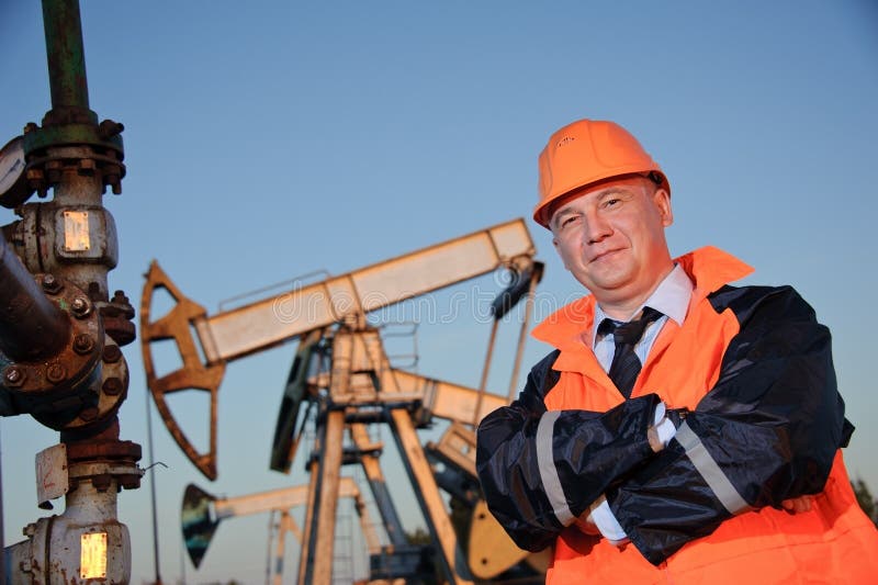 Engineer in an Oil field stock image. Image of inspector 21478113