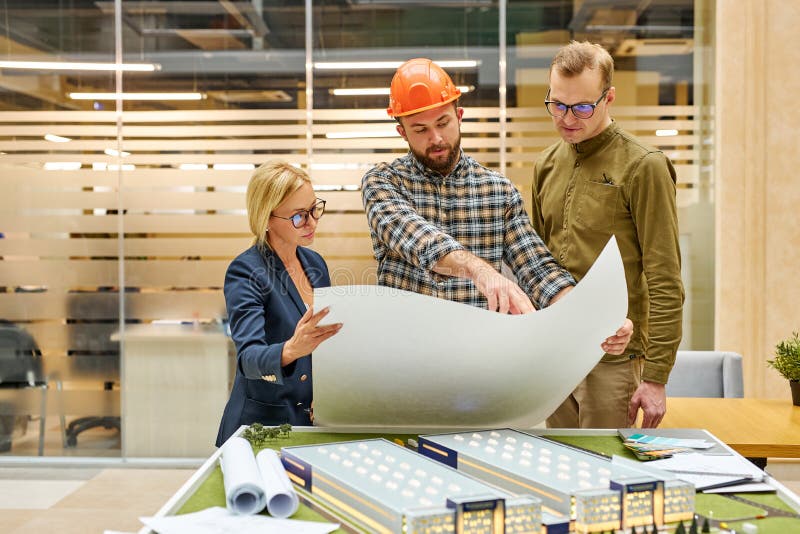 Engineer Show Plan for House Building To Female Director of Company