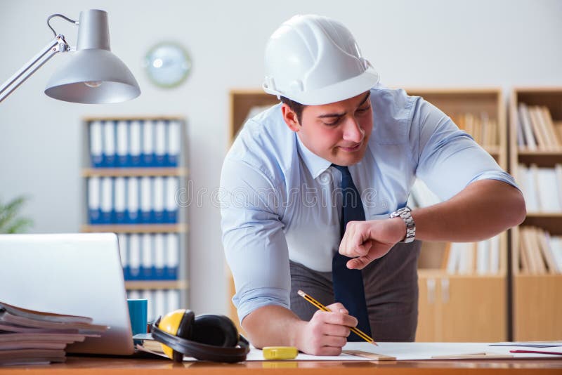 The engineer supervisor working on drawings in the office. Drawing, building.