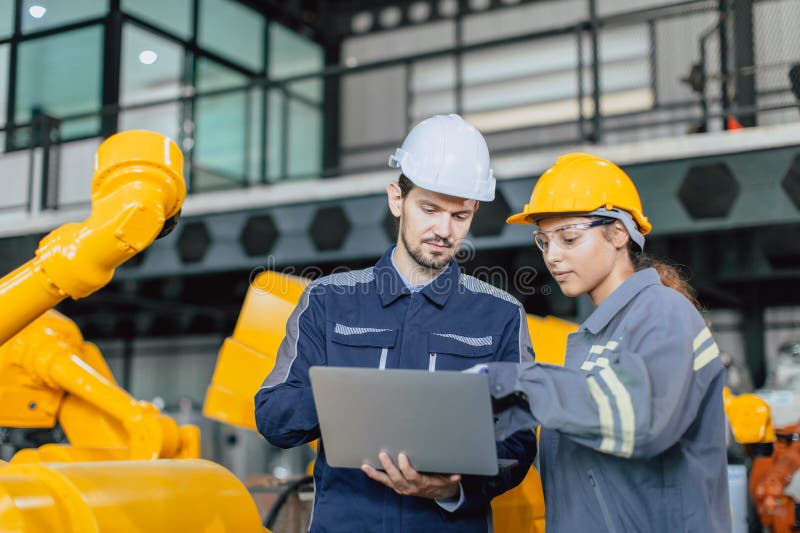 Engineer Team Working Together Inspection Quality Robot Arm in Robot