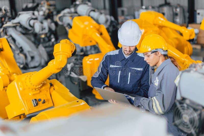 Engineer Team Working Together Inspection Quality Robot Arm in Robot