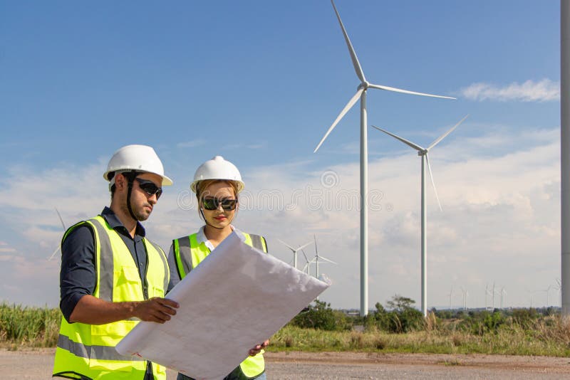 Engineer Team Working in Wind Turbine Farm. Renewable Energy with Wind