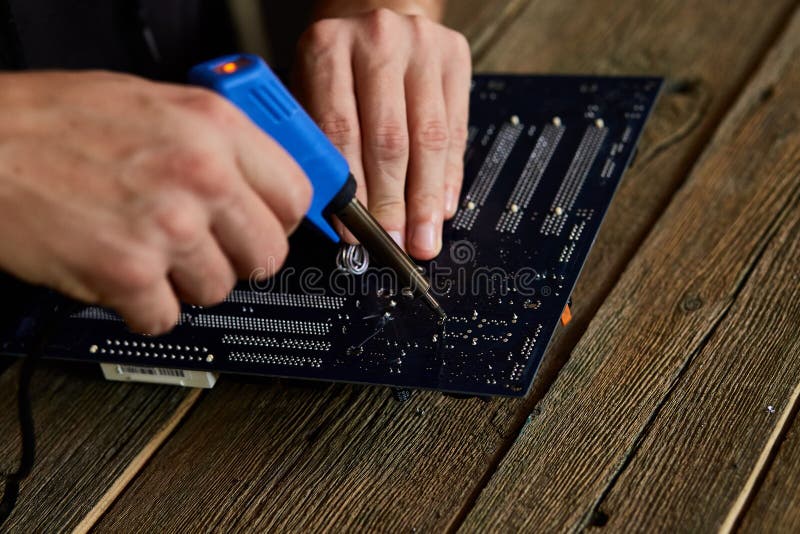 Engineer Or Technician Repair Electronic Circuit Board With Soldering Iron Stock Photo Image