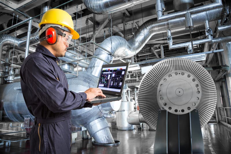 Engineer using laptop computer in thermal power plant factory royalty free stock photo