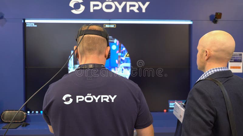 HELSINKI, FINLAND - MAY 30, 2018: Engineer are using virtual AR to simulate industrial space, repair and design various technological designs. Industry 4. 0 concept by finnish company Poyry during the exhibition PacTec in Helsinki
