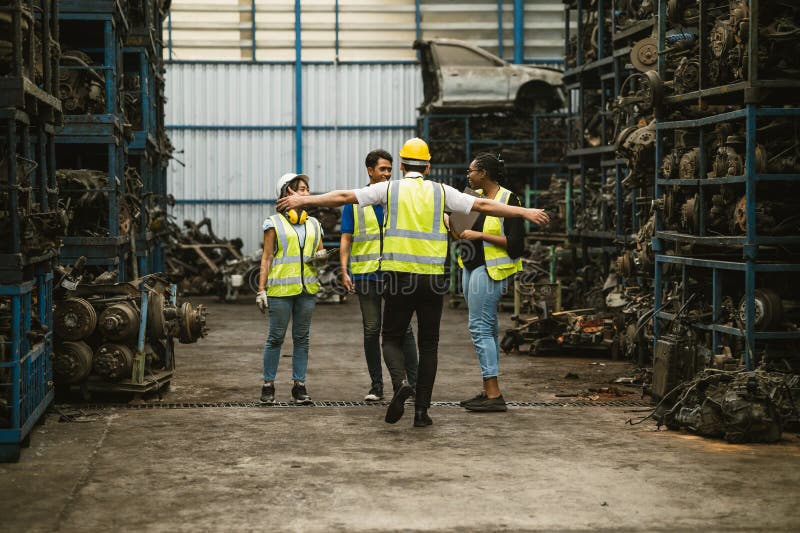 Engineer worker team together happy working in old grunge garage used auto part warehouse royalty free stock image