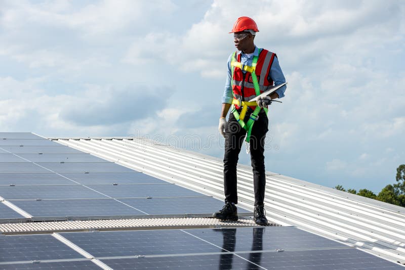 Engineer Working Setup Solar Panel at the Roof Top. Engineer or Worker