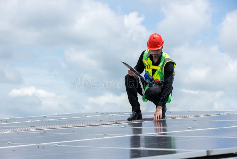 Engineer Working Setup Solar Panel at the Roof Top. Engineer or Worker