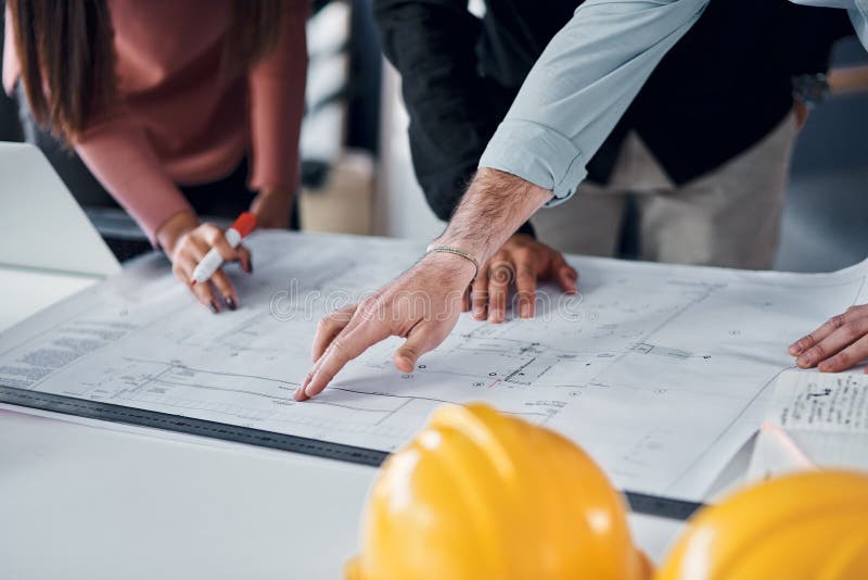Engineering, collaboration or hands with blueprint in office for creative, innovation or design decision. Construction royalty free stock photos