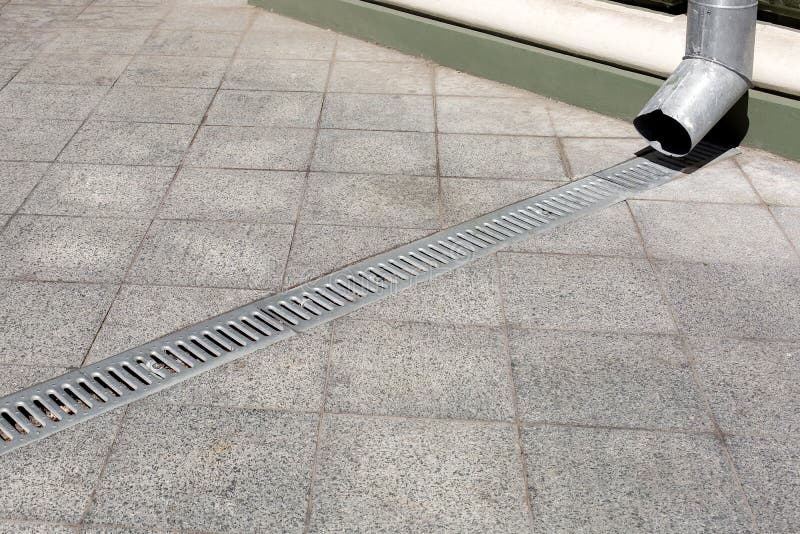 Engineering Structure Downspout on Facade Building with Drainage Grate