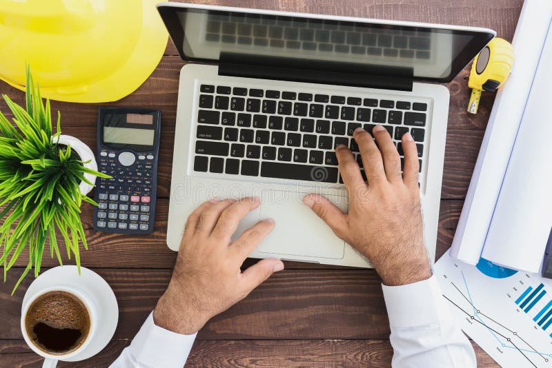 Engineering using laptop computer on top stock images