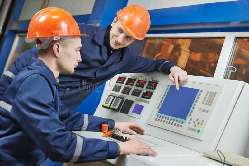Engineers at control panel stock photos