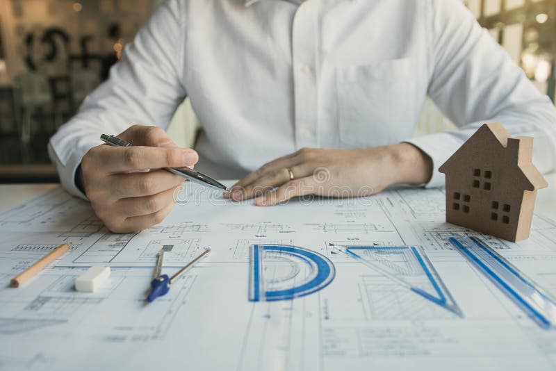 Engineers are Designing Working on Blueprints and Analyzing the