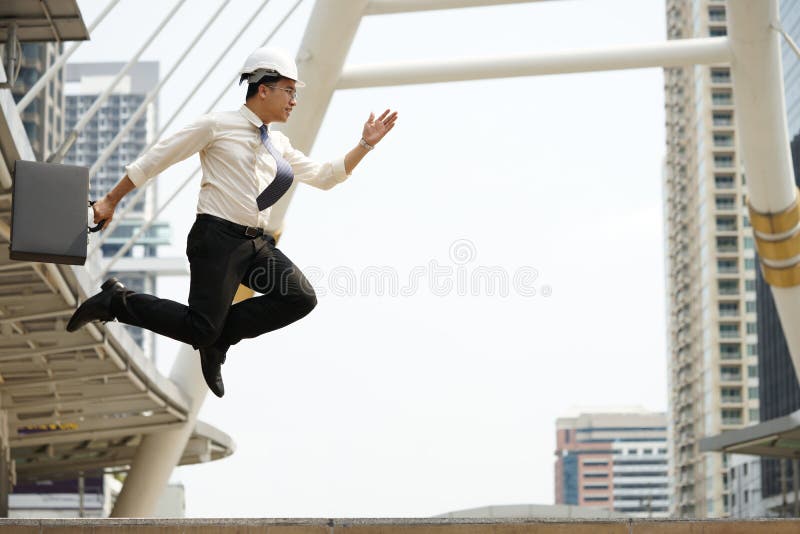 Engineers strive jump high as possible in order achieve goals royalty free stock photography Engineers strive jump high as possible in order achieve goals royalty free stock photography