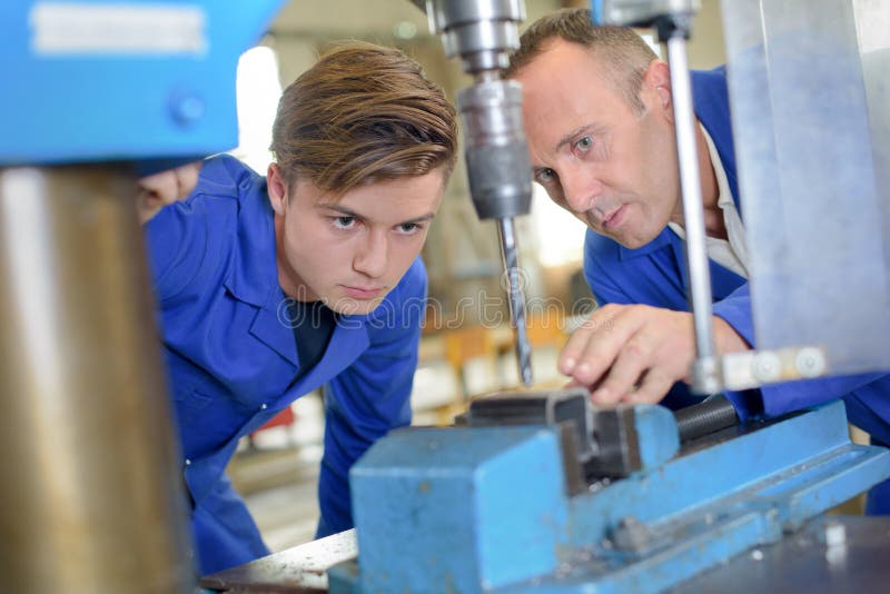 Engineers Using Bench Drill Stock Photo Image of bore, occupation