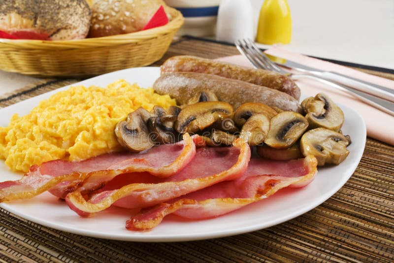 English Breakfast with Scrambled Eggs and Sausages royalty free stock images English Breakfast with Scrambled Eggs and Sausages royalty free stock images
