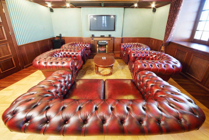 English cigar room with leather armchairs for rest
