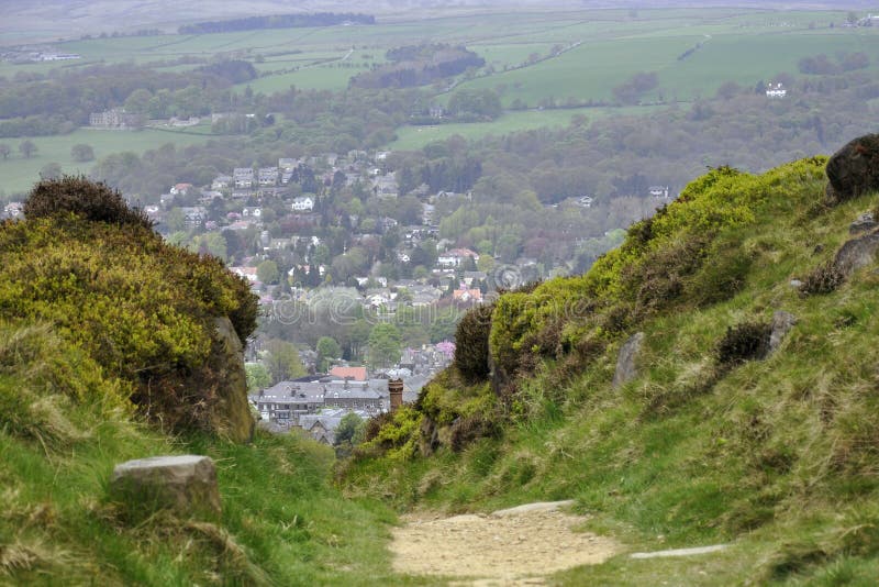 English countryside landscape: houses, trail, bush