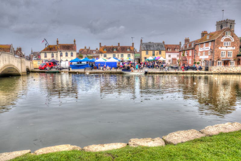 English town market Wareham Dorset with people and stalls situated on the River Frome near Poole in colourful HDR