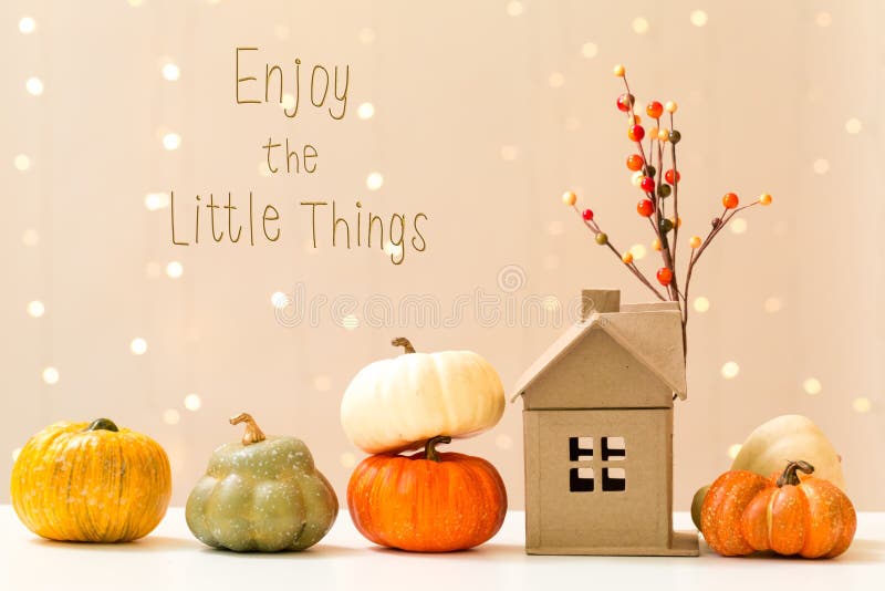 Enjoy the little things message with pumpkins with a house royalty free stock photos Enjoy the little things message with pumpkins with a house royalty free stock photos