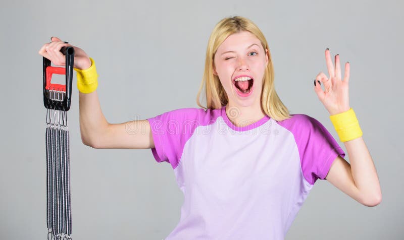 Enjoy result. Exercising with expander equipment. Sport equipment concept. Improve your body. Achieve great shape. Woman royalty free stock photos Enjoy result. Exercising with expander equipment. Sport equipment concept. Improve your body. Achieve great shape. Woman royalty free stock photos