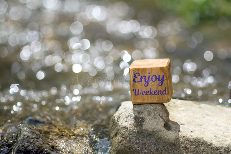 Enjoy weekend on wooden block stock photos