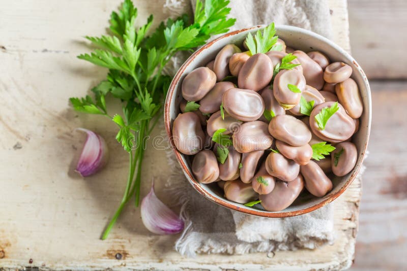 Enjoy your broad beans in old rustic kitchen stock photos