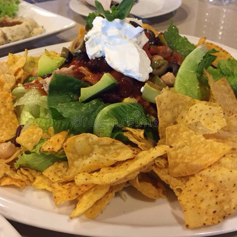 Enjoy your dinner! Top view of food and drinks on the rustic wooden table. royalty free stock photo