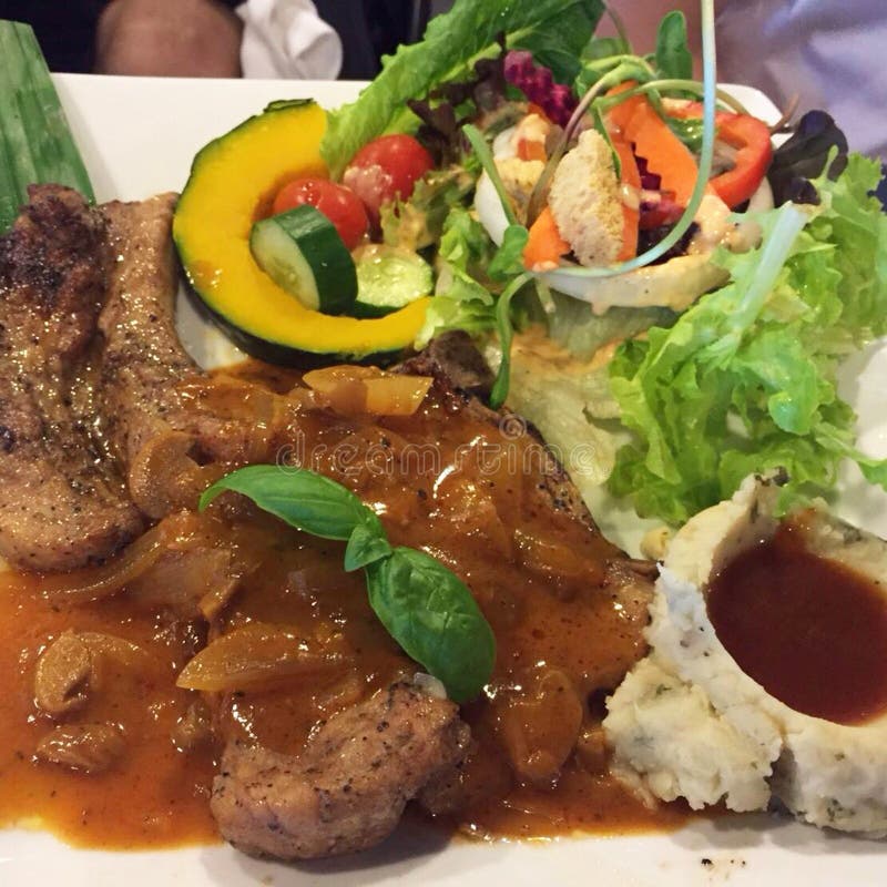 Enjoy your dinner! Top view of food and drinks on the rustic wooden table. royalty free stock image