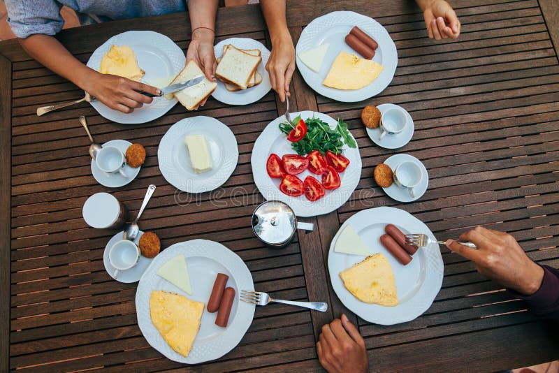 Top view of group of people having breakfast together royalty free stock photo Top view of group of people having breakfast together royalty free stock photo