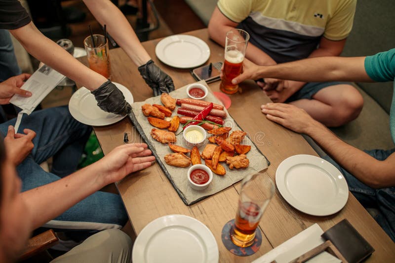 Enjoying Dinner Together. Top View of Four People Having Dinner