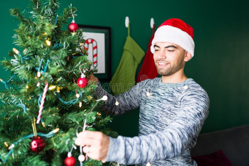 Enjoying Putting Up The Christmas Tree Stock Image Image Of Cozy Latin 230390529