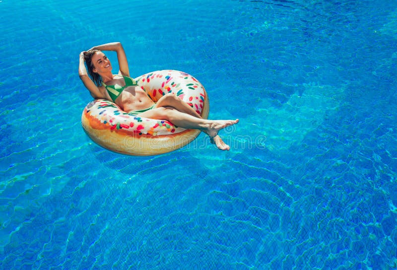 Enjoying suntan Woman in bikini on the inflatable mattress stock photography Enjoying suntan Woman in bikini on the inflatable mattress stock photography