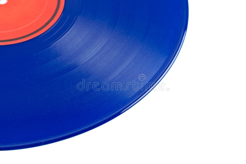 Dusty vinyl record with red label isolated on white background. Shallow depth of field. Dusty vinyl record with red label isolated on white background. Shallow depth of field