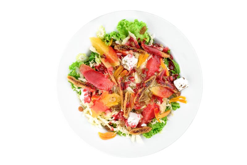 Ensalada del vegano con la naranja, los higos, el apio, el albaricoque, el queso del queso de soja y pasas en una placa blanca ai fotografía de archivo Ensalada del vegano con la naranja, los higos, el apio, el albaricoque, el queso del queso de soja y pasas en una placa blanca ai fotografía de archivo
