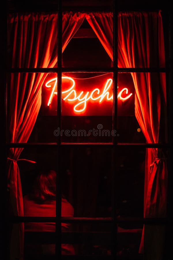 Psychic neon sign at night, in the West Village, Manhattan, New York City. Psychic neon sign at night, in the West Village, Manhattan, New York City.