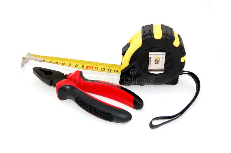 Set of construction tools on white - tape measure and pliers. Set of construction tools on white - tape measure and pliers