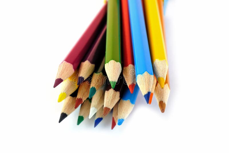 Colored pencils placed in random order isolated on white background. Colored pencils placed in random order isolated on white background