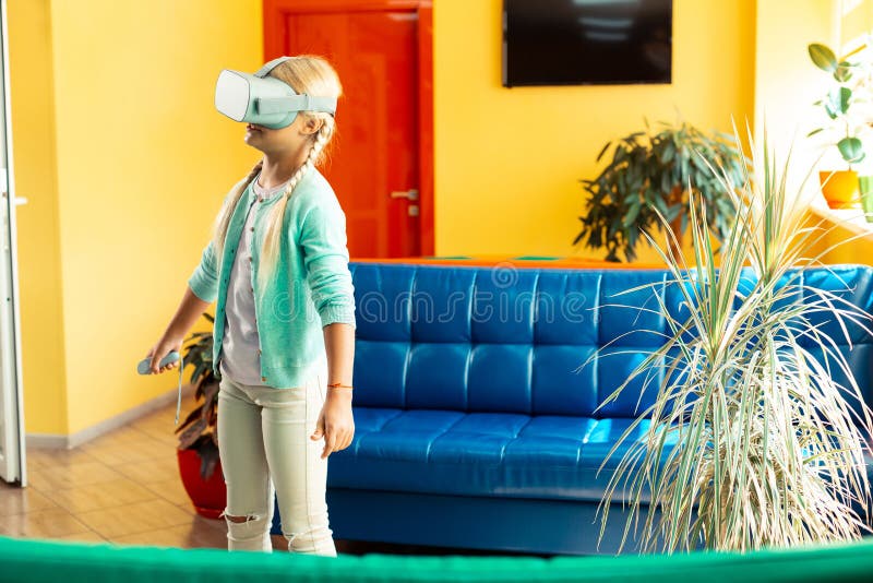 Girl being in virtual world during her school breaktime. stock photography