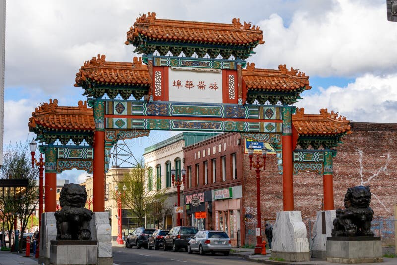 Portland, United States - Apr 10, 2018 : The Chinatown Gateway sculpture is at the entrance to the Old Town Chinatown neighborhood and was built in Taiwan and erected in Portland in 1986. Portland, United States - Apr 10, 2018 : The Chinatown Gateway sculpture is at the entrance to the Old Town Chinatown neighborhood and was built in Taiwan and erected in Portland in 1986.