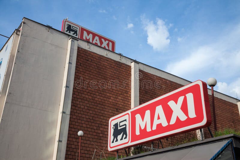 Entrance of a Maxi Supermarket with Its Logo. Belonging To the Belgian ...