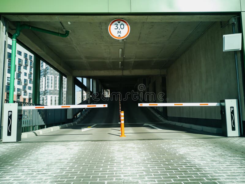 Entrance To the Covered Multi-level Parking for Cars with a Barrier and ...