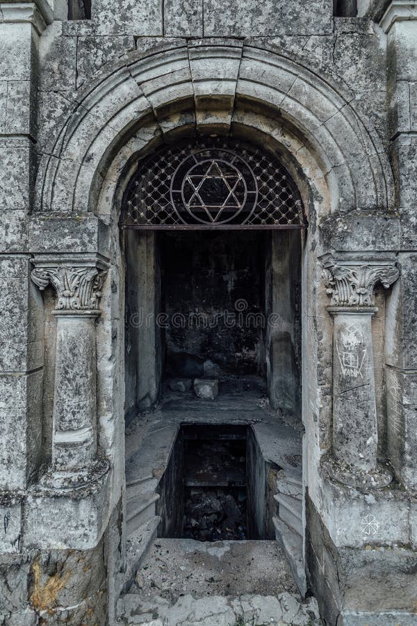 Entrance to an old family-owned mausoleum, a crypt on an abandoned Jewish cemetery in Sevastopol