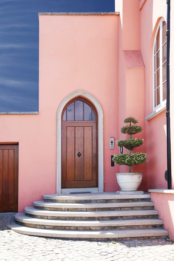 pink home / house entrance with steps